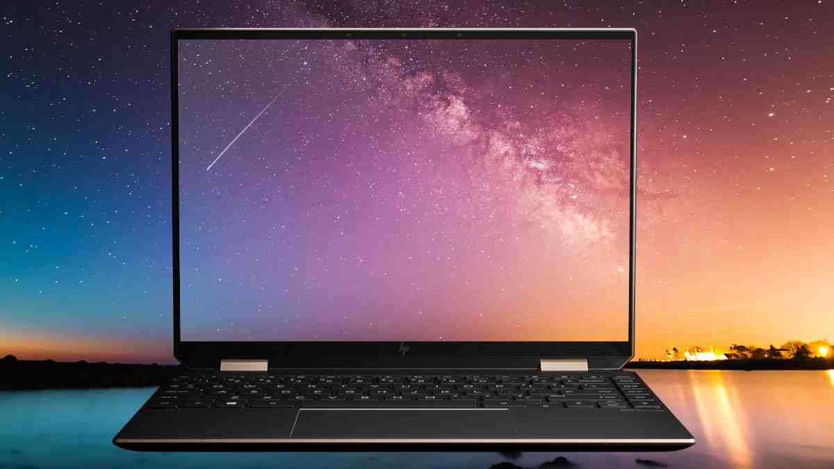 HP Spectre x360 14 laptop showing vibrant colors on its 2.8K OLED display in laptop mode