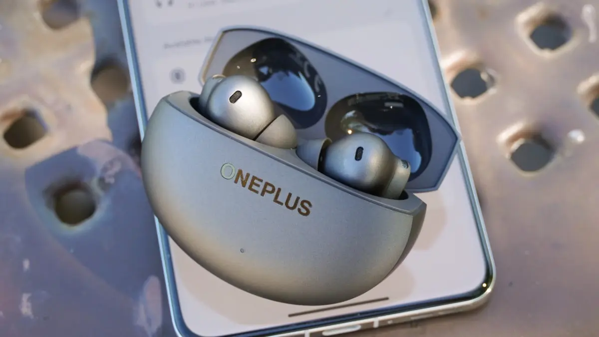OnePlus Buds 4 case design showing compact pebble shape and Storm Grey finish